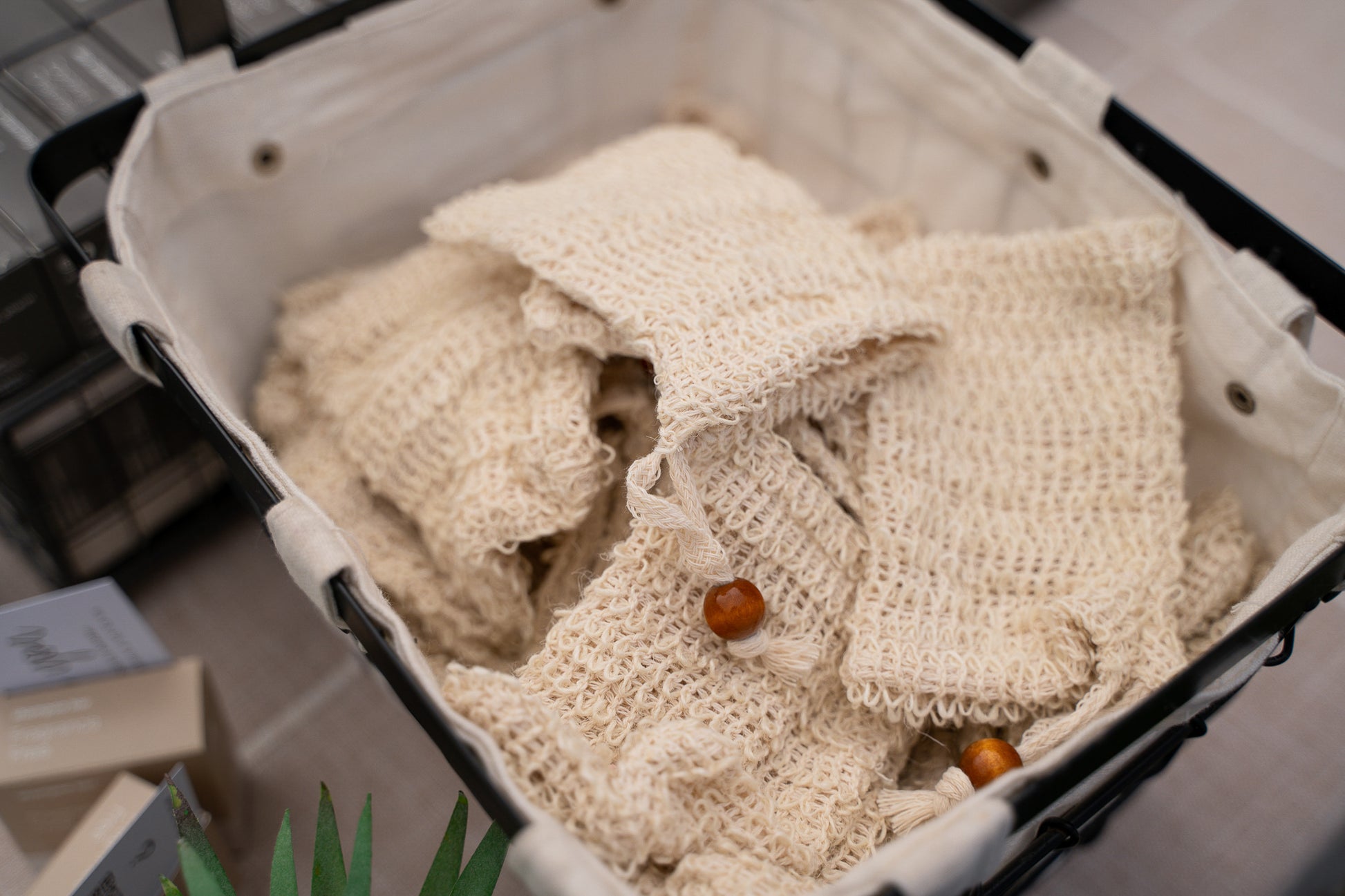 A basket full of hand woven sisal fiber bar saver bag